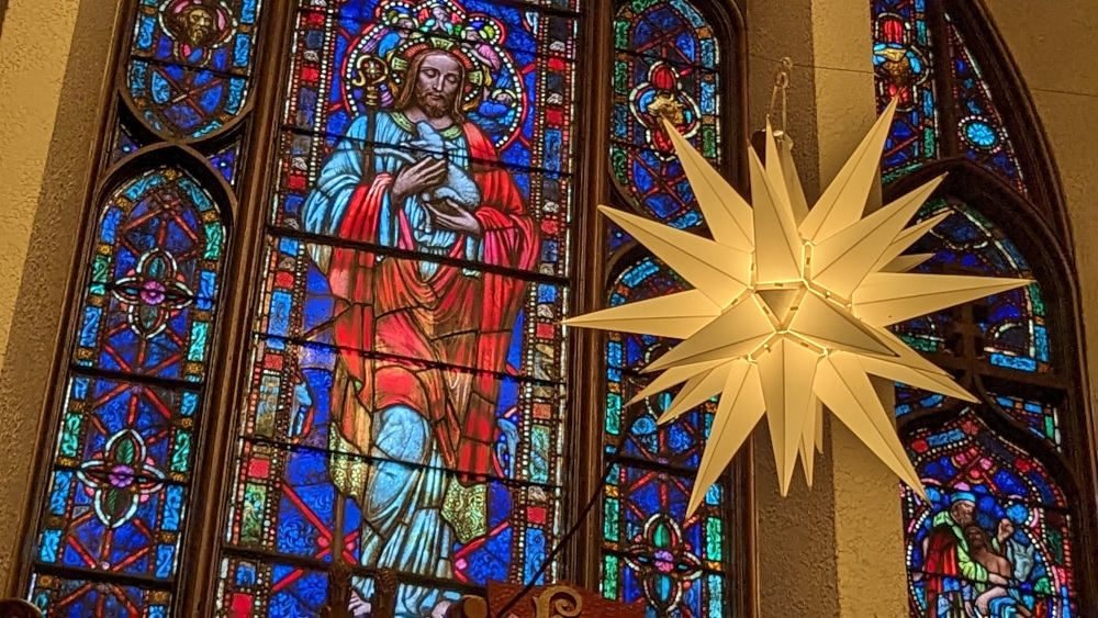 Hanover's historic stained glass window at Christmas time, reflecting the light of the Star of Bethlehem.
